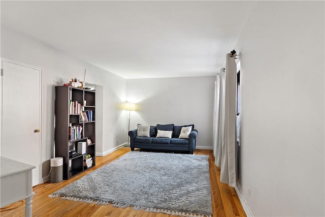 sitting room with hardwood / wood-style flooring