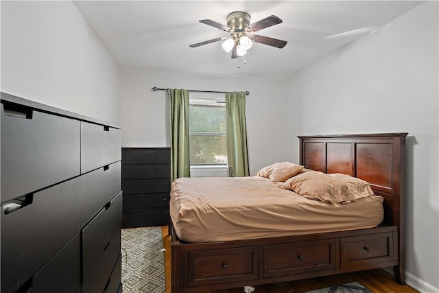 bedroom with ceiling fan and light hardwood / wood-style flooring