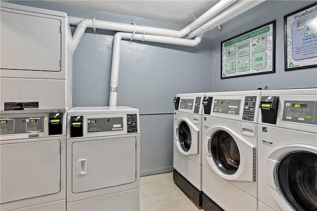 clothes washing area with separate washer and dryer and stacked washer and clothes dryer