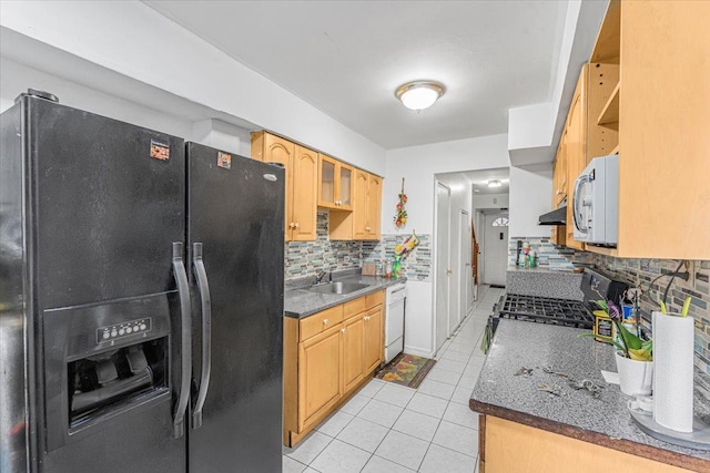 kitchen with backsplash, white appliances, sink, and light tile patterned floors