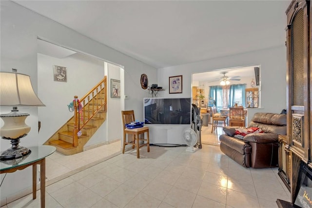 living room with ceiling fan and light tile patterned floors