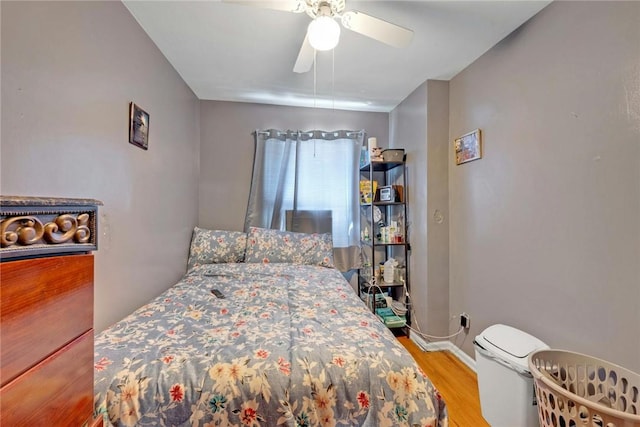 bedroom featuring ceiling fan and light hardwood / wood-style flooring