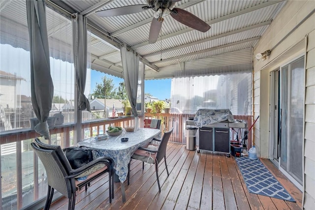 wooden terrace with area for grilling and ceiling fan