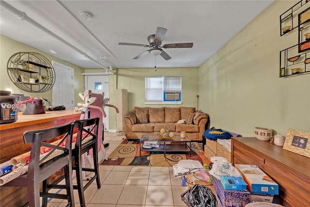 tiled living room featuring ceiling fan