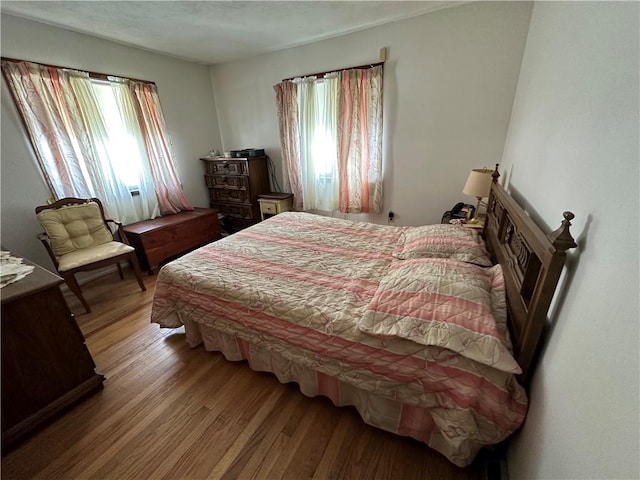 bedroom with hardwood / wood-style floors