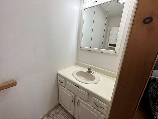 bathroom with tile patterned flooring and vanity