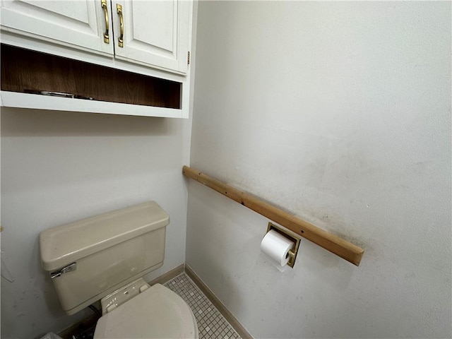 bathroom featuring tile patterned floors and toilet