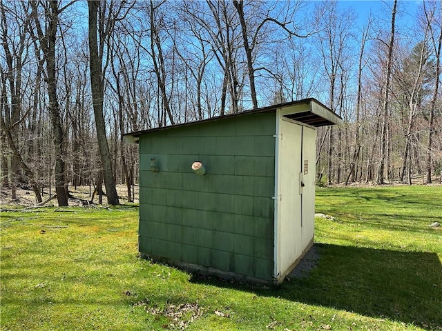 view of outbuilding with a lawn