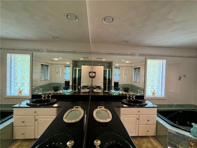 kitchen with white cabinets, plenty of natural light, and dark hardwood / wood-style floors