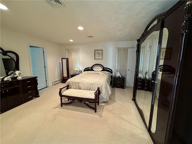 bedroom with baseboard heating and light colored carpet