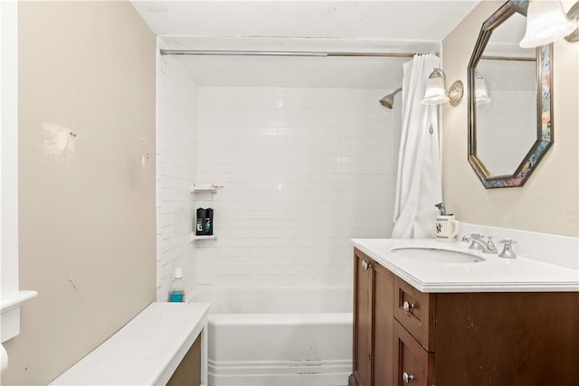 bathroom featuring shower / bath combo and vanity