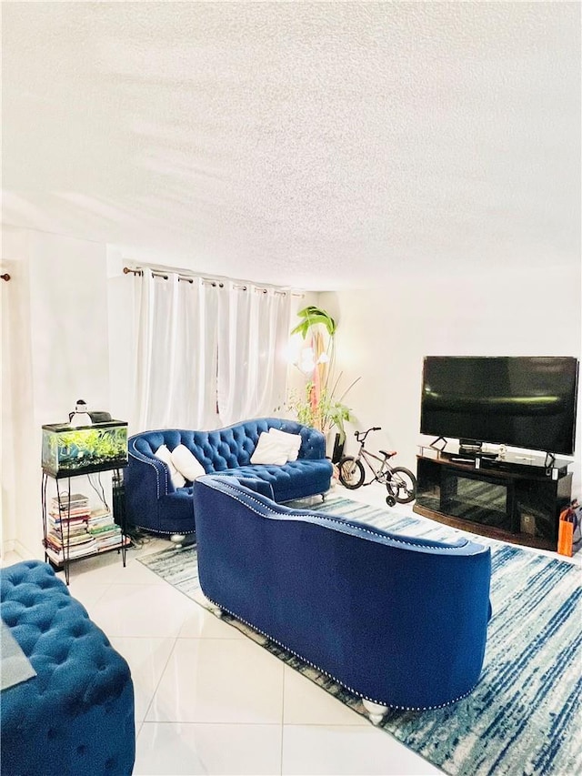 living room with tile patterned flooring and a textured ceiling