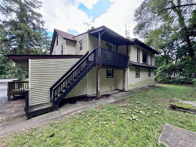 view of side of property with a yard