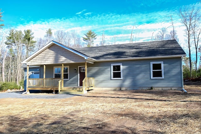 single story home with a porch