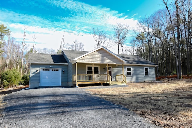 ranch-style house featuring a porch and a garage