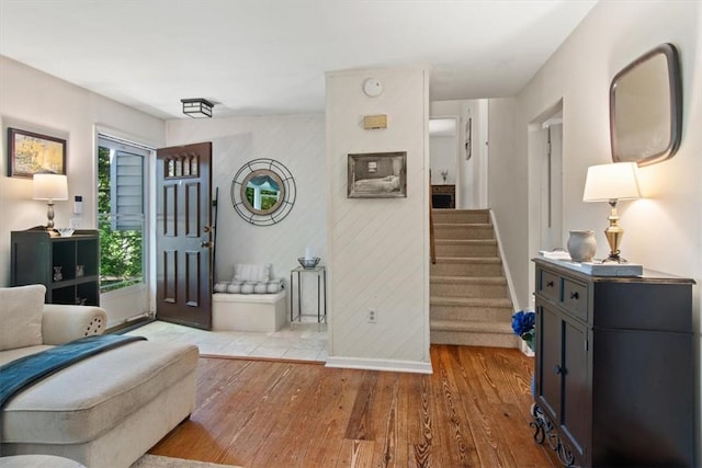 foyer entrance with light hardwood / wood-style floors