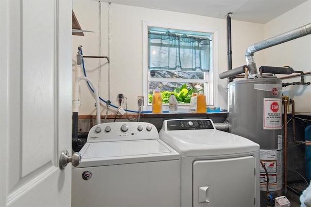 washroom featuring washing machine and dryer and water heater