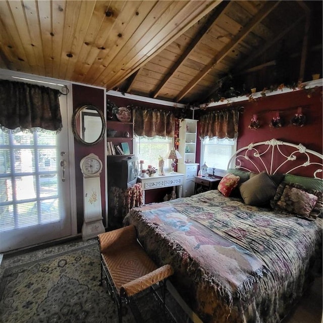 bedroom featuring lofted ceiling, wood ceiling, and multiple windows