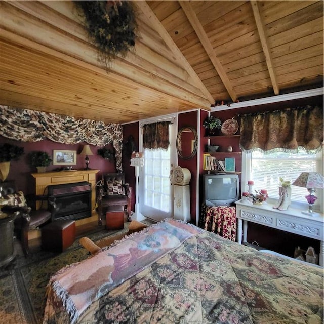 bedroom with vaulted ceiling with beams, multiple windows, and wood ceiling