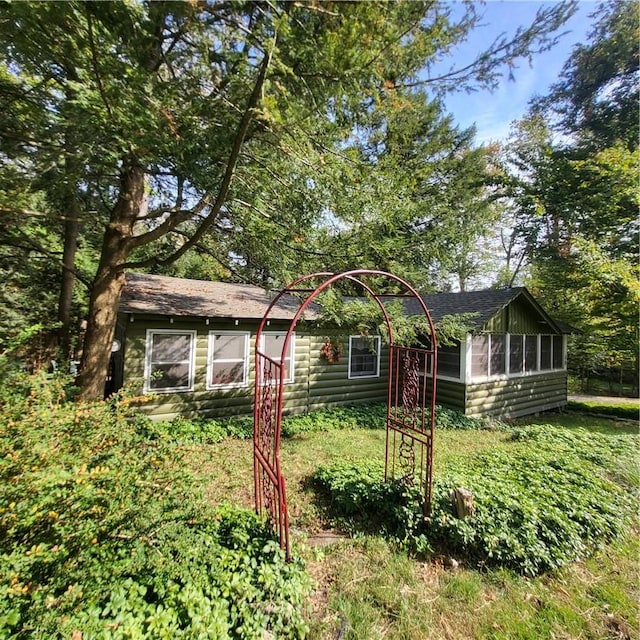 view of front of home with a sunroom