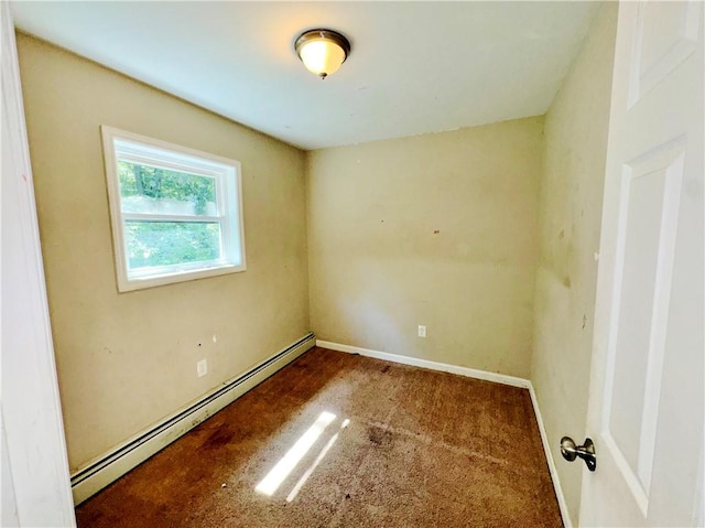 empty room featuring carpet and baseboard heating