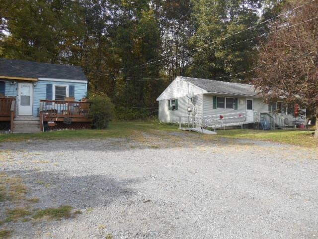 view of front of property with a wooden deck