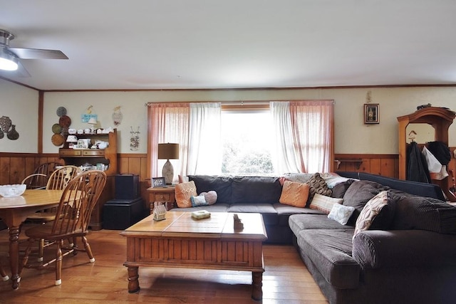 living room featuring ceiling fan and light hardwood / wood-style floors