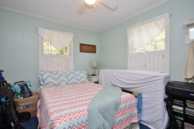 bedroom featuring ceiling fan and crown molding