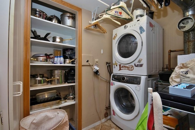 laundry area with stacked washer and clothes dryer