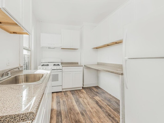 kitchen featuring white cabinetry, sink, dark wood-type flooring, and white appliances