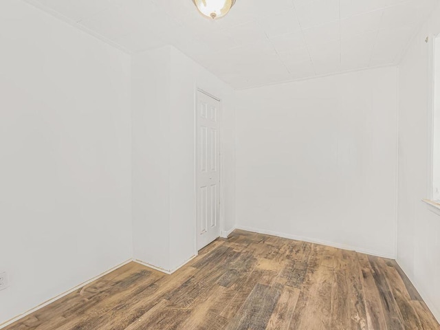 unfurnished room with hardwood / wood-style floors