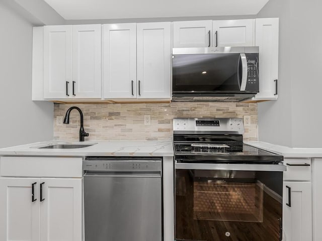 kitchen featuring sink, white cabinets, and stainless steel appliances