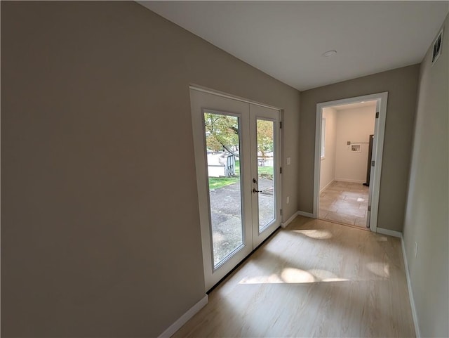 doorway to outside featuring light hardwood / wood-style flooring