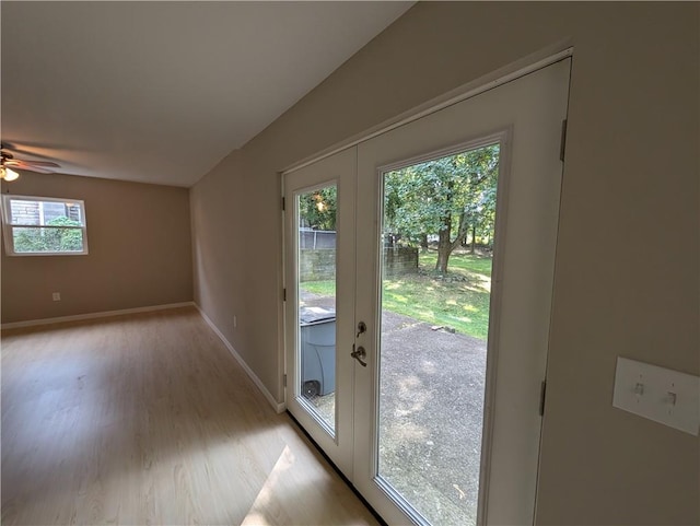 entryway featuring ceiling fan, a healthy amount of sunlight, and light hardwood / wood-style floors