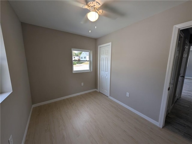 unfurnished bedroom featuring a closet, ceiling fan, and light hardwood / wood-style flooring