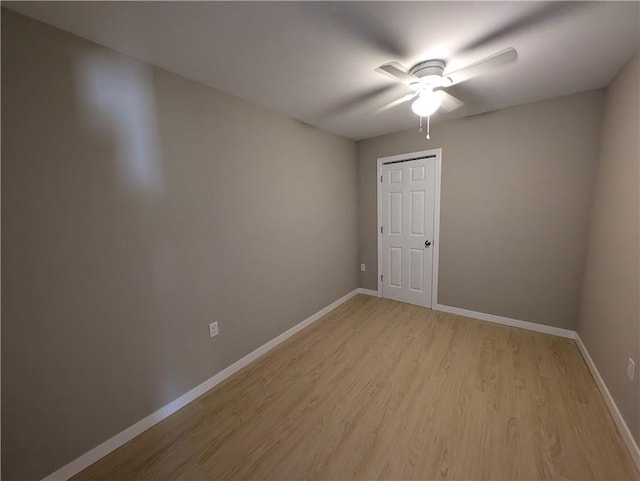 spare room with light hardwood / wood-style flooring and ceiling fan