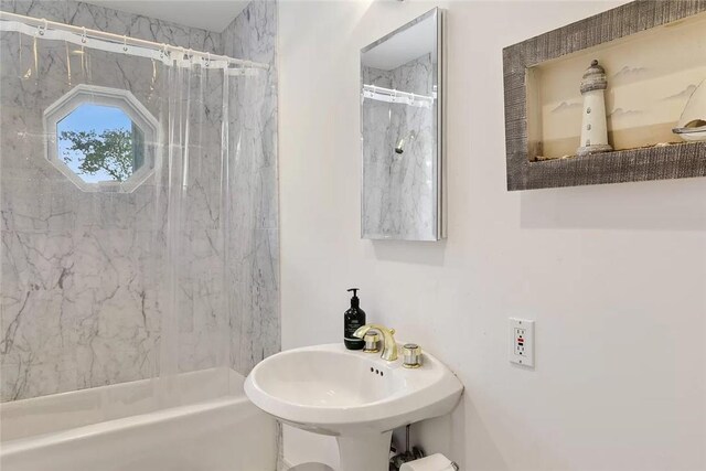 18 Brushy Neck Ln, Westhampton, NY 11977 - bathroom featuring a marble finish shower and a sink