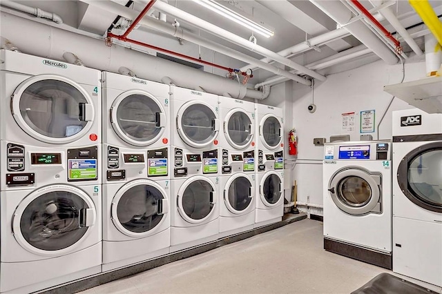 washroom with washing machine and dryer and stacked washer / drying machine