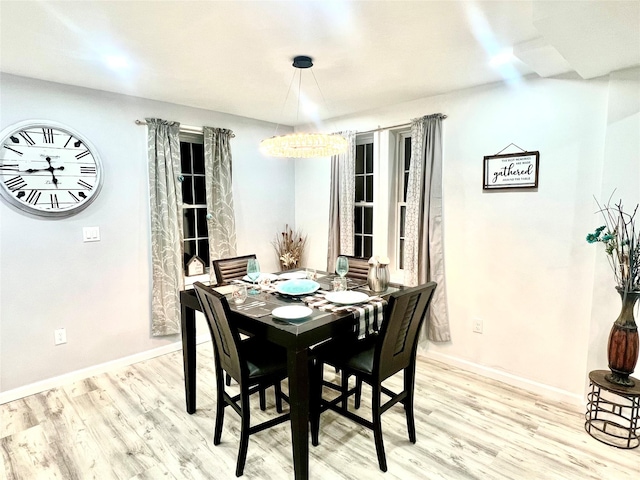 dining area with light hardwood / wood-style flooring