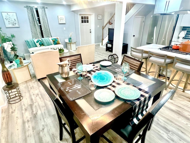 dining space featuring light hardwood / wood-style flooring