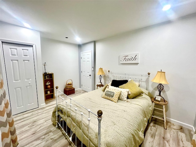 bedroom with light hardwood / wood-style floors