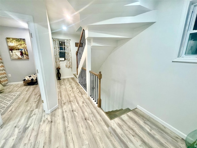 stairway with wood-type flooring