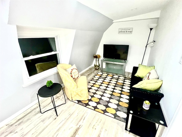 living room with light wood-type flooring and lofted ceiling