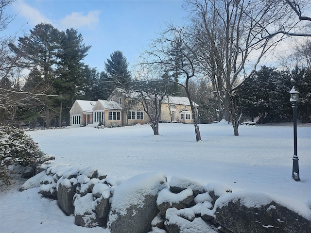 view of yard layered in snow