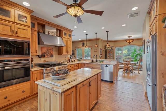 kitchen featuring a center island, hanging light fixtures, wall chimney range hood, kitchen peninsula, and appliances with stainless steel finishes