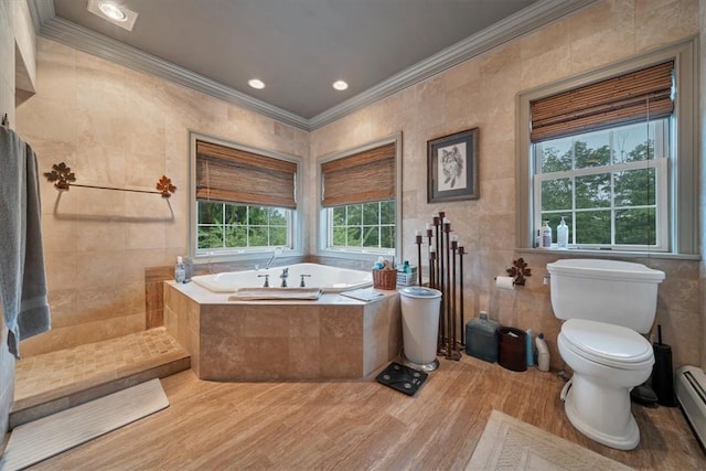 bathroom with separate shower and tub, baseboard heating, crown molding, hardwood / wood-style flooring, and tile walls