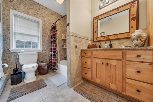 full bathroom with tile patterned floors, vanity, toilet, and shower / bath combo with shower curtain