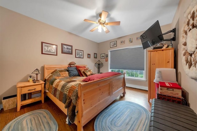 bedroom with hardwood / wood-style flooring and ceiling fan