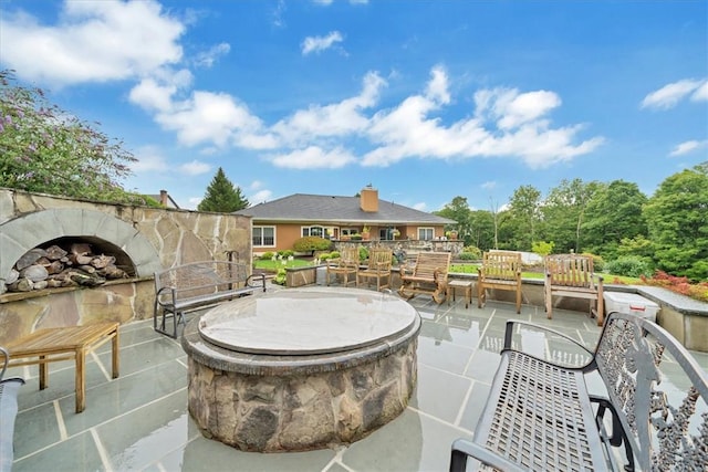 view of patio featuring an outdoor fire pit