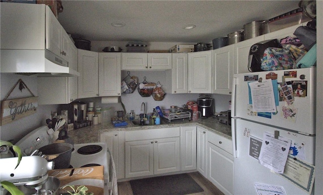 kitchen featuring white cabinetry, white appliances, sink, and extractor fan